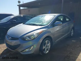 2013 Hyundai Elantra Coupe GS with VIN KMHDH6AE6DU013174, listed as a IAAI auction lot 41771119 with 143,115 mi miles. Bid and sale history available at carsss.com. Image 2.