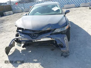 2019 Toyota Camry LE with VIN 4T1B11HK9KU810347, listed as a IAAI auction lot 41804007 with 75,063 mi miles and . Bid and sale history available at DreamBid. Image 6.