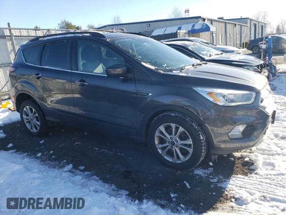 2017 Ford Escape SE with VIN 1FMCU9GD2HUB71458, listed as a Copart auction lot 41383445 with 143,125 mi miles and Salvage Title. Bid and sale history available at carsss.com. Image 4.