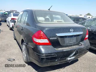 2009 Nissan Versa S with VIN 3N1BC11E19L440957, listed as a IAAI auction lot 40039437 with Not Provided miles and . Bid and sale history available at DreamBid. Image 3.