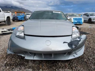 2004 Nissan 350Z Enthusiast z VIN JN1AZ34D54T152775, wystawiony jako Copart lot #56900385 z przebiegiem 182 564 mil mil oraz Szkoda całkowita • Salvage title. Historia ofert i sprzedaży dostępna na DreamBid. Obrazek 5.
