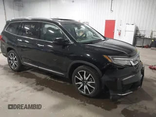 2021 Honda Pilot Touring 7-Passenger with VIN 5FNYF6H63MB082603, listed as a IAAI auction lot 42312764 with 60,000 mi miles and . Bid and sale history available at DreamBid. Image 1.