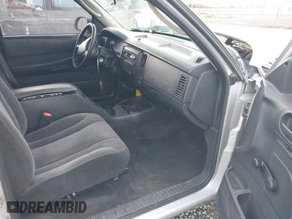 2002 Dodge Dakota with VIN 1B7GL12X42S698285, listed as a IAAI auction lot 40826030 with 211,936 mi miles and . Bid and sale history available at carsss.com. Image 5.