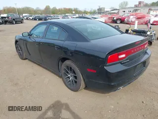 2012 Dodge Charger SE with VIN 2C3CDXBG1CH218814, listed as a IAAI auction lot 42125550 with 113,784 mi miles. Bid and sale history available at carsss.com. Image 3.