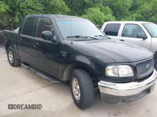2002 Ford F-150 XLT with VIN 1FTRW07692KE26387, listed as a IAAI auction lot 42079023 with 218,876 mi miles. Bid and sale history available at carsss.com. Image 1.