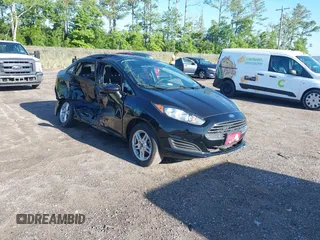 2019 Ford Fiesta SE z VIN 3FADP4BJ2KM159022, wystawiony jako IAAI lot #42269813 z przebiegiem 55 107 mil mil oraz . Historia ofert i sprzedaży dostępna na DreamBid. Obrazek 1.