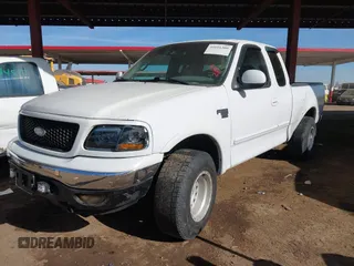 1999 Ford F-150 XL with VIN 2FTRX18L9XCA21004, listed as a IAAI auction lot 41616300 with 186,620 mi miles. Bid and sale history available at carsss.com. Image 2.