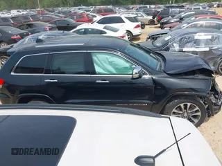 2017 Jeep Grand Cherokee Overland z VIN 1C4RJFCG4HC662884, wystawiony jako IAAI lot #42172826 z przebiegiem 79 305 mil mil oraz . Historia ofert i sprzedaży dostępna na DreamBid. Obrazek 13.