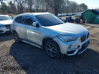 2018 BMW X1 xDrive28i with VIN WBXHT3C30J5L29757, listed as a IAAI auction lot 41879504 with 60,490 mi miles. Bid and sale history available at carsss.com. Image 1.