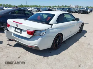 2015 BMW 4 Series 428i z VIN WBA3V7C52FP771779, wystawiony jako IAAI lot #41953647 z przebiegiem 66 003 mil mil oraz . Historia ofert i sprzedaży dostępna na DreamBid. Obrazek 4.