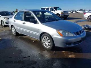 2006 Mitsubishi Lancer ES with VIN JA3AJ26E06U057959, listed as a IAAI auction lot 41347649 with 122,963 mi miles. Bid and sale history available at carsss.com. Image 1.