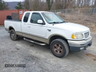 1999 Ford F-150 XL with VIN 1FTRX18LXXKA75357, listed as a IAAI auction lot 41630371 with 202,021 mi miles. Bid and sale history available at carsss.com. Image 1.