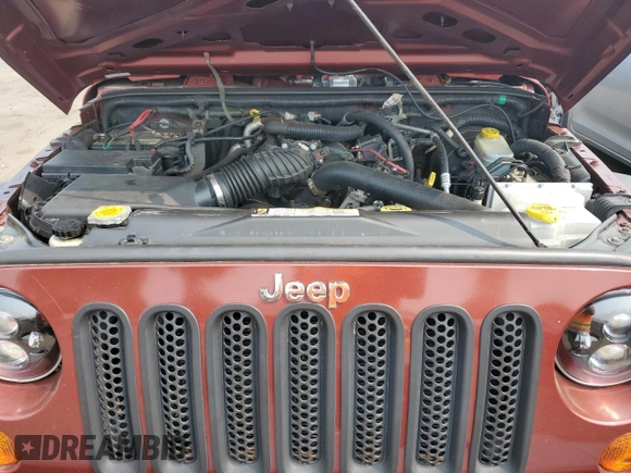 2007 Jeep Wrangler Unlimited X z VIN 1J4GA391X7L169728, wystawiony jako Copart lot #59484265 z przebiegiem 165 674 mil mil oraz Szkoda całkowita • Salvage title. Historia ofert i sprzedaży dostępna na DreamBid. Obrazek 11.