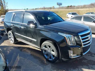 2015 Cadillac Escalade Premium with VIN 1GYS4CKJ0FR180180, listed as a IAAI auction lot 41054933 with 146,974 mi miles. Bid and sale history available at carsss.com. Image 1.