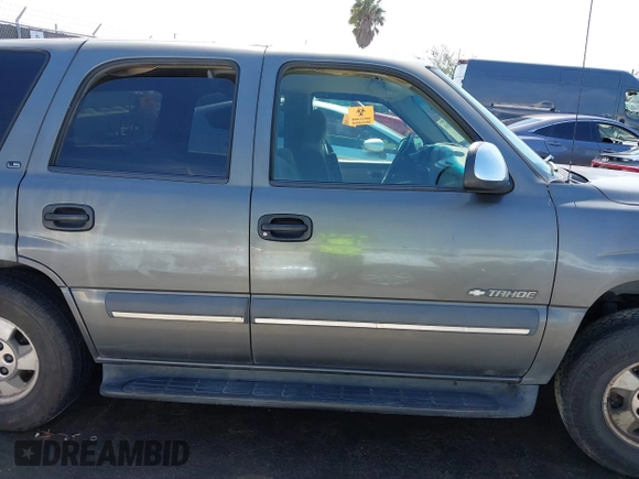 2002 Chevrolet Tahoe LS z VIN 1GNEC13V92R305304, wystawiony jako IAAI lot #41851210 z przebiegiem Nie podano mil oraz . Historia ofert i sprzedaży dostępna na DreamBid. Obrazek 13.