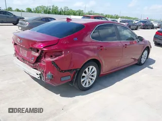 2020 Toyota Camry LE with VIN 4T1L11AK3LU993342, listed as a IAAI auction lot 42033420 with 84,849 mi miles and . Bid and sale history available at DreamBid. Image 4.