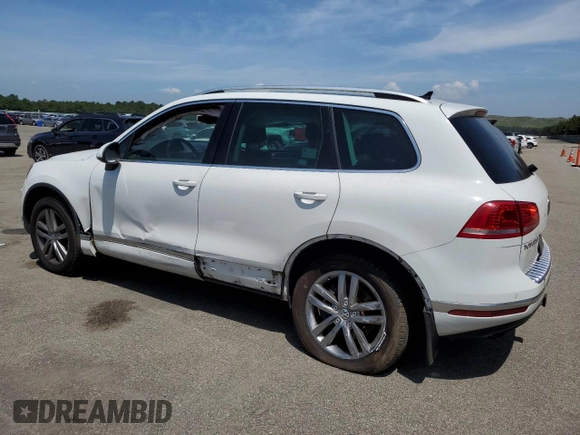 2016 Volkswagen Touareg Sport with VIN WVGEF9BPXGD010830, listed as a Copart auction lot 58663734 with 148,091 mi miles and Salvage Title. Bid and sale history available at DreamBid. Image 2.