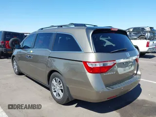 2012 Honda Odyssey EX-L z VIN 5FNRL5H63CB033049, wystawiony jako IAAI lot #42260501 z przebiegiem 165 693 mil mil oraz . Historia ofert i sprzedaży dostępna na DreamBid. Obrazek 3.