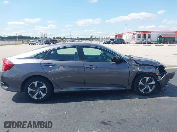 2020 Honda Civic LX with VIN 19XFC2F68LE007735, listed as a IAAI auction lot 42215294 with 3,849 mi miles and . Bid and sale history available at DreamBid. Image 13.