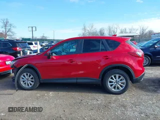2016 Mazda CX-5 Touring with VIN JM3KE4CY5G0630438, listed as a IAAI auction lot 41877660 with 56,960 mi miles. Bid and sale history available at carsss.com. Image 15.