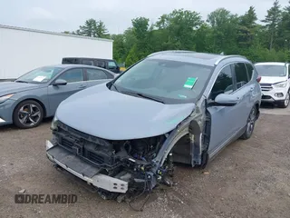 2021 Honda CR-V Touring with VIN 7FART6H91ME022993, listed as a IAAI auction lot 42439344 with 30,477 mi miles and . Bid and sale history available at DreamBid. Image 2.