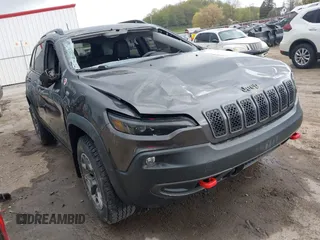 2022 Jeep Cherokee Trailhawk z VIN 1C4PJMBX5ND518361, wystawiony jako IAAI lot #42091499 z przebiegiem 23 159 mil mil oraz . Historia ofert i sprzedaży dostępna na DreamBid. Obrazek 1.