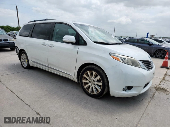 2015 Toyota Sienna XLE with VIN 5TDYK3DC4FS617099, listed as a Copart auction lot 61128025 with 114,508 mi miles and Salvage title. Bid and sale history available at DreamBid. Image 4.