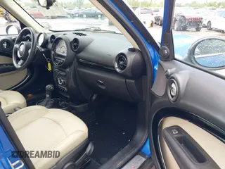 2014 MINI Countryman S z VIN WMWZC5C52EWP38659, wystawiony jako IAAI lot #42229976 z przebiegiem 115 229 mil mil oraz . Historia ofert i sprzedaży dostępna na DreamBid. Obrazek 5.