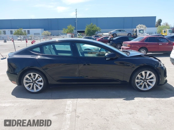 2019 Tesla Model 3 Long Range with VIN 5YJ3E1EB6KF192477, listed as a IAAI auction lot 41981600 with 62,888 mi miles. Bid and sale history available at carsss.com. Image 13.
