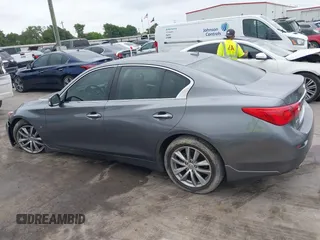 2015 Infiniti Q50 Premium z VIN JN1BV7AR7FM408015, wystawiony jako IAAI lot #42083301 z przebiegiem 58 817 mil mil oraz . Historia ofert i sprzedaży dostępna na DreamBid. Obrazek 14.