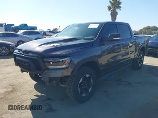 2022 Ram 1500 Rebel z VIN 1C6SRFLT4NN177112, wystawiony jako IAAI lot #42402050 z przebiegiem 26 239 mil mil oraz . Historia ofert i sprzedaży dostępna na DreamBid. Obrazek 17.