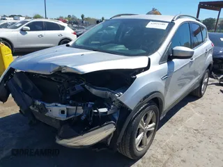 2016 Ford Escape SE with VIN 1FMCU0G96GUA99637, listed as a IAAI auction lot 41851586 with 61,143 mi miles. Bid and sale history available at carsss.com. Image 2.