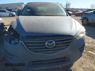 2016 Mazda CX-5 Sport with VIN JM3KE2BY3G0641895, listed as a IAAI auction lot 41689138 with 121,636 mi miles and . Bid and sale history available at DreamBid. Image 13.