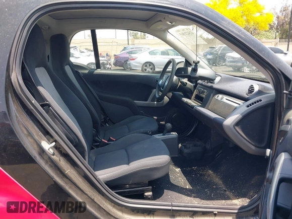 2014 Smart fortwo Pure z VIN WMEEJ3BAXEK744079, wystawiony jako IAAI lot #42421069 z przebiegiem 79 788 mil mil oraz . Historia ofert i sprzedaży dostępna na DreamBid. Obrazek 8.