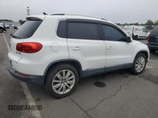 2013 Volkswagen Tiguan SE with VIN WVGAV3AX1DW574009, listed as a Copart auction lot 60936735 with 121,624 mi miles and Clean title. Bid and sale history available at DreamBid. Image 3.
