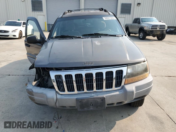 1999 Jeep Grand Cherokee Laredo with VIN 1J4G258S9XC731752, listed as a Copart auction lot 58601555 with 245,284 mi miles and Salvage title. Bid and sale history available at DreamBid. Image 5.