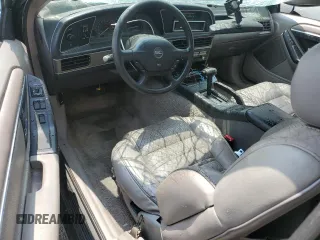 1989 Ford Thunderbird z VIN 1FAPP64R0KH161691, wystawiony jako Copart lot #60097275 z przebiegiem 70 041 mil mil oraz Szkoda całkowita • Salvage title. Historia ofert i sprzedaży dostępna na DreamBid. Obrazek 8.