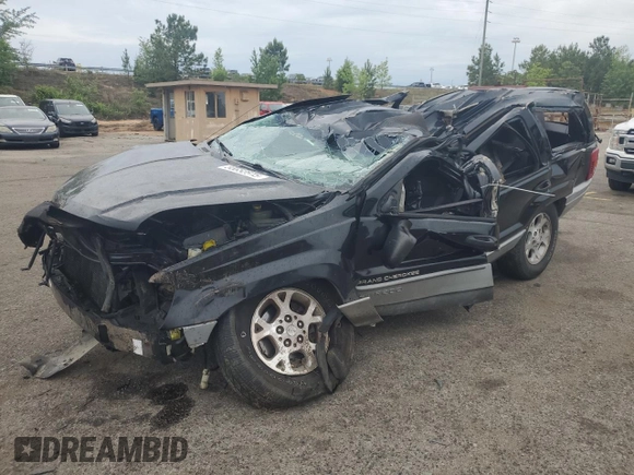 2000 Jeep Grand Cherokee Laredo with VIN 1J4G248S4YC390675, listed as a Copart auction lot 55652815 with Not provided miles and Salvage title. Bid and sale history available at DreamBid. Image 1.