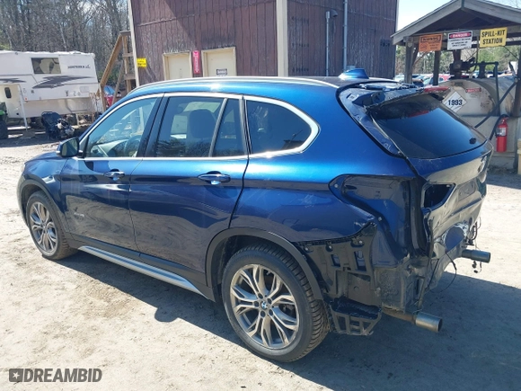2017 BMW X1 xDrive28i with VIN WBXHT3C33H5F82035, listed as a IAAI auction lot 41944399 with 102,942 mi miles. Bid and sale history available at carsss.com. Image 3.