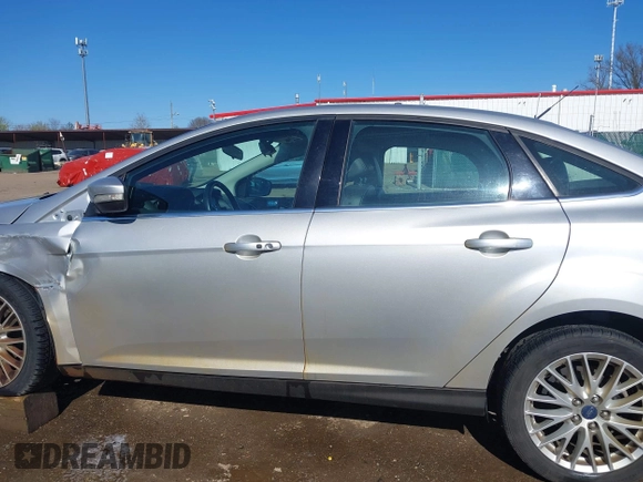 2014 Ford Focus Titanium with VIN 1FADP3J28EL354505, listed as a IAAI auction lot 42025966 with 104,868 mi miles. Bid and sale history available at carsss.com. Image 15.