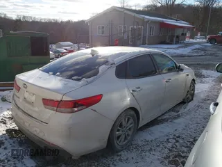 2016 Kia Optima LX with VIN KNAGT4L30G5117378, listed as a IAAI auction lot 41283349 with 107,095 mi miles. Bid and sale history available at carsss.com. Image 4.