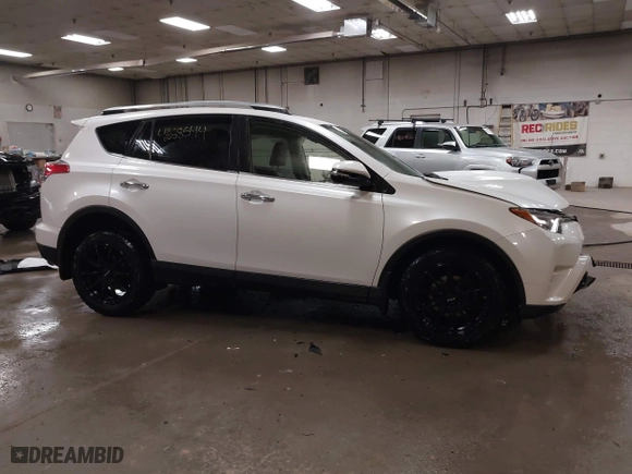 2018 Toyota RAV4 Limited with VIN JTMDFREV6JJ186499, listed as a IAAI auction lot 41668544 with 130,336 mi miles. Bid and sale history available at carsss.com. Image 14.