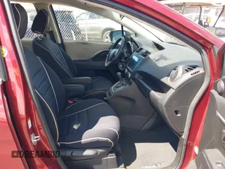 2012 Mazda 5 Touring with VIN JM1CW2CLXC0113181, listed as a IAAI auction lot 42653061 with 94,441 mi miles and . Bid and sale history available at DreamBid. Image 5.
