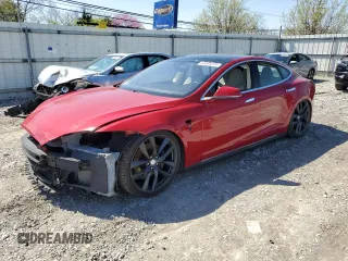 2014 Tesla Model S 60 with VIN 5YJSA1S12EFP65799, listed as a Copart auction lot 50895235 with 132,669 mi miles and Salvage Title. Bid and sale history available at DreamBid. Image 1.