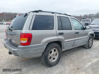 1999 Jeep Grand Cherokee Laredo with VIN 1J4GW58N4XC676836, listed as a IAAI auction lot 41799381 with 203,784 mi miles. Bid and sale history available at carsss.com. Image 4.