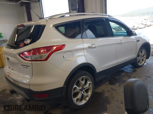 2013 Ford Escape Titanium with VIN 1FMCU9J96DUC60268, listed as a IAAI auction lot 42095407 with 105,307 mi miles and . Bid and sale history available at DreamBid. Image 4.