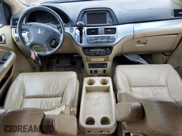 2010 Honda Odyssey Touring with VIN 5FNRL3H94AB056657, listed as a Copart auction lot 72658934 with 202,690 mi miles and Salvage title. Bid and sale history available at DreamBid. Image 8.