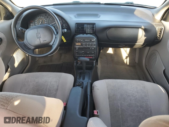 1999 Saturn SL with VIN 1G8ZK5274XZ367394, listed as a Copart auction lot 63863795 with 73,197 mi miles and Salvage title. Bid and sale history available at DreamBid. Image 8.