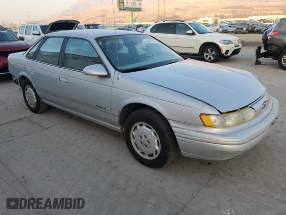 1995 Ford Taurus GL with VIN 1FALP52U5SA320424, listed as a Copart auction lot 83676194 with 177,817 mi miles and Salvage title. Bid and sale history available at DreamBid. Image 4.