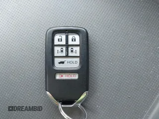 2014 Honda Odyssey Touring with VIN 5FNRL5H94EB079518, listed as a IAAI auction lot 42095098 with 141,019 mi miles and . Bid and sale history available at DreamBid. Image 11.